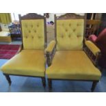 An early 20th century his and hers parlour chairs in a gold coloured fabric