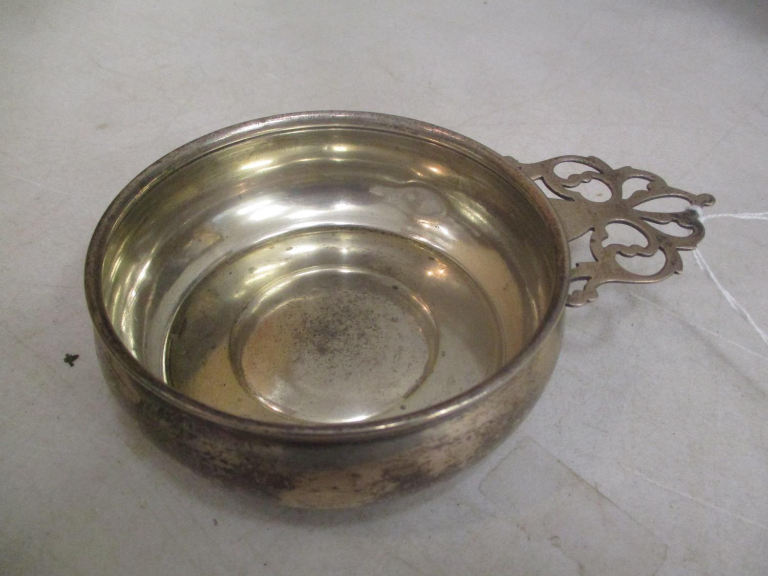 A sterling silver pierced handled quaich, 89.95g