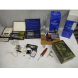 A mixed lot of costume jewellery, boxed silver plated cutlery and a child's sewing machine, along