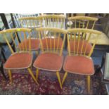 A set of six vintage Ercol blonde elm and beech stick back dining chairs with later padded seats
