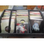 Over 250 7"singles in a black leather DJ's carry case to include The Who, Dr, Def Leppard, Wizard,