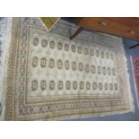 A cream Bokhara rug A/F
