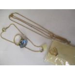 A selection of 9ct gold and yellow metal jewellery to include a ring set with a blue stone, a