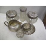A selection of silver and white metal items to include silver topped dressing table pots, total