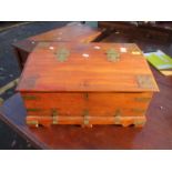 An Indian teak brass bound travelling box having twin carrying handles and fitted compartments 27.