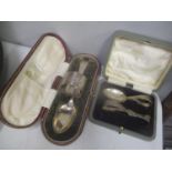 Two early 20th century silver cased christening sets, 102.95g