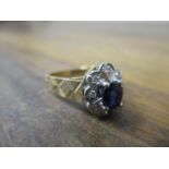 A 9ct gold ring set with a sapphire and diamond, 3.5g