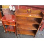 An early 20th century oak open bookcase having sausage and pea moulding, together with a