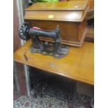 A late 19th/early 20th century Singer treadle sewing machine table