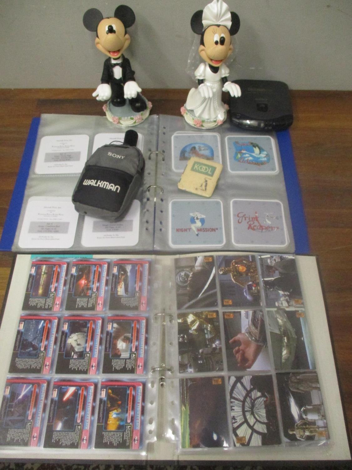 A mixed lot to include an album of Aircraft Nose Art coasters, album of Star Wars cards, a Kool