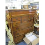 A large reproduction mahogany chest having a central square drawer Location: CR