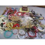 A mixed lot of costume jewellery to include beaded necklaces, bangles, earrings and other items