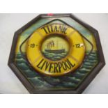 A reproduction wooden plaque depicting the Titanic 1912 at sea with a raised image of a lifeguard