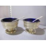 Two Victorian silver salts with blue glass liners