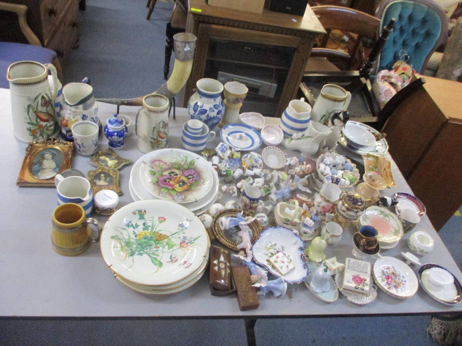 A mixed lot to include a horn mounted on a stand, Cornish ware, Goebel bird ornament, thimbles, late