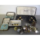 A mixed lot to include a cased stud set, a 15ct gold stud 1.5g, an Oriental charm and others