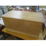 A Victorian pine trunk having twin carrying handles 46cm h x 97cm w