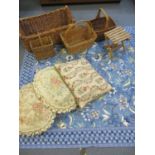 A quantity of baskets, tapestry cushions and a blue cotton tablecloth decorated with leaves and