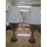 A pair of brass and painted vase design table lamps, with shades, 82cm h