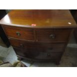 A reproduction bow fronted chest of two short and two long drawers on splayed legs 81cm h x 76.5cm w