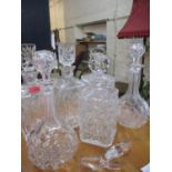 Six 20th century glass decanters with stoppers and two additional stoppers