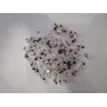 Parcel of loose mixed stones including cubic zirconia, amethyst, ruby, emerald, garnet and