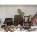 A carved and painted figure of a woodpecker on a tree trunk, carved book ends, vintage darts,