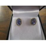 9ct yellow gold oval-cut tanzanite and round-cut diamond cluster stud earrings, boxed