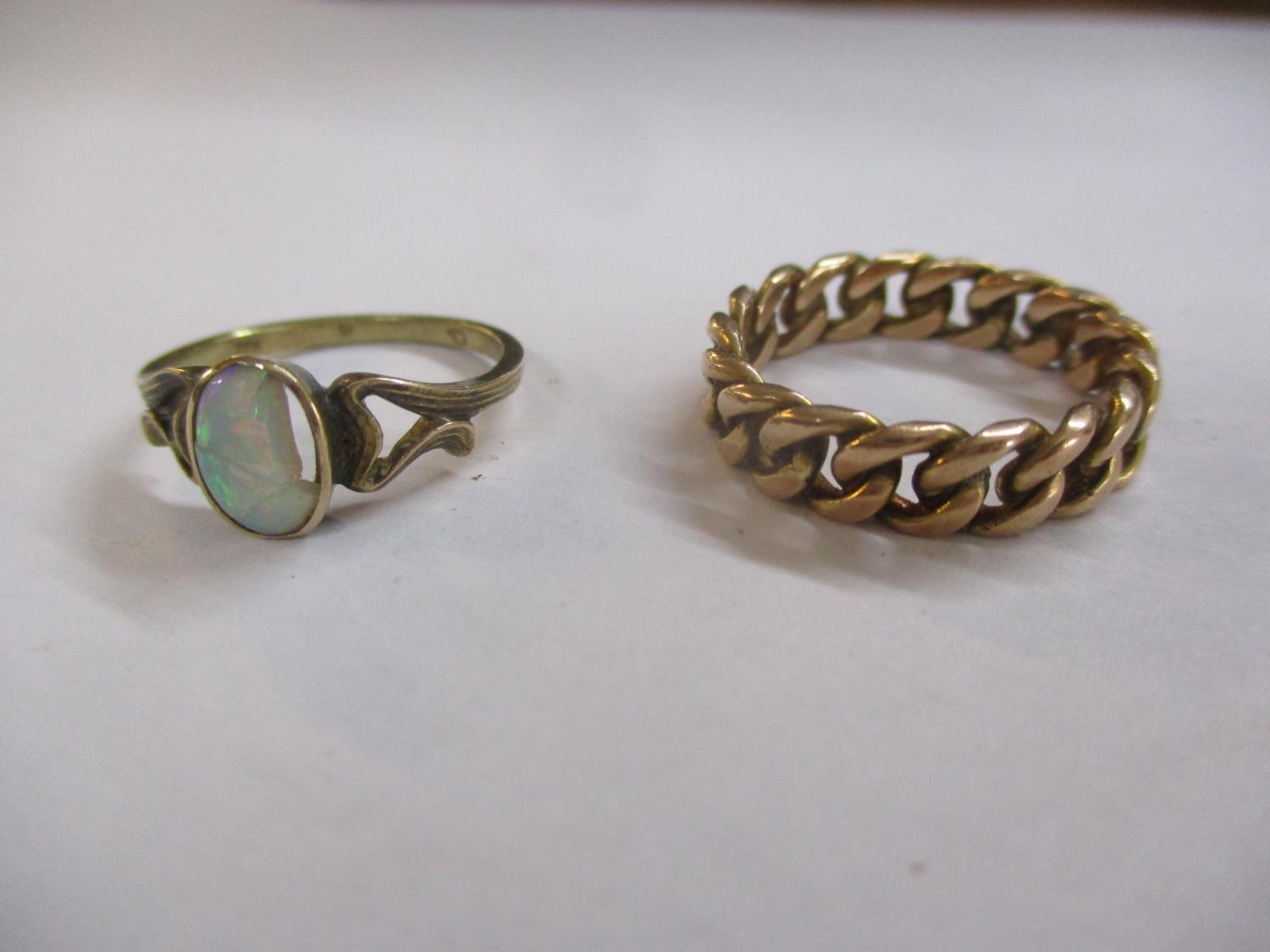 Two gold coloured rings, one set with an opal, damaged, 6.5g