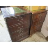 Two modern mahogany finished two drawer filing cabinets, non-matching both with green leather