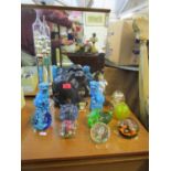 A mixed lot to include glass paperweights, along with a Whitefriars blue controlled bubble weight, a