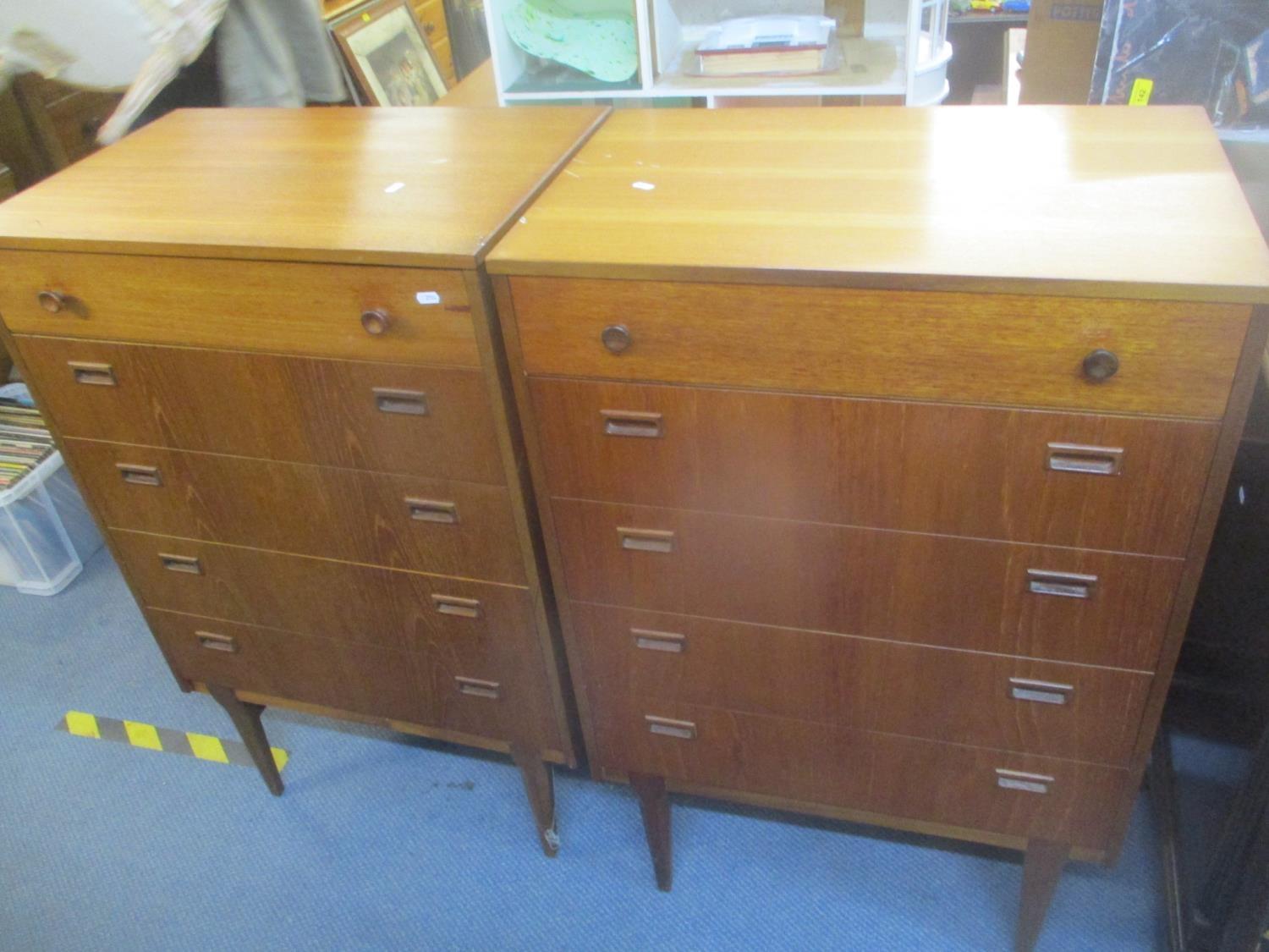 A pair of mid 20th century retro teak chests of five long drawers, 106.5h x 69cm w