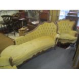 A reproduction French style walnut chaise longue and a pair of matching armchairs