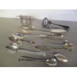 Mixed silver items to include a mustard pot, sugar tongs and other items 279.5g