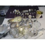 A quantity of silver plate, white metal and silver items to include cutlery and flatware, all housed