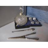 Silver to include a scent bottle with a silver collar, silver handled glove stretchers, button
