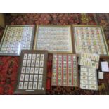 A group of framed and glazed sets of cigarette cards to include Wills cigarettes of Allied Army
