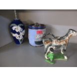 A Lambeth Doulton tobacco jar, a Royal Copenhagen vase, a creamer in the form of a cow and other