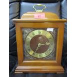 A late 20th century wooden cased Smiths mantle clock with key and a wall clock