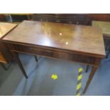 An early 19th century mahogany fold over tea table having single inset drawer and tapering legs, 73h