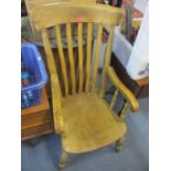 An early 20th century beech lathe back armchair with a moulded seat 108cm h x 53cm w