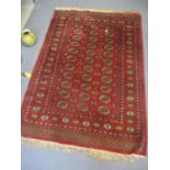 A red ground Bokhara rug A/F 185cm x 126 cm