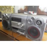 An Aiwa CD/tape player with two speakers