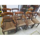 A matched set of eight early 19th century mahogany bar back dining chairs having turned front legs