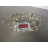 A silver dish with twin wreath handles and pierced sides, 16cm w, 88g