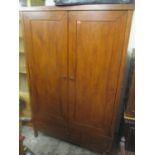 A large modern wardrobe having two doors above three drawers 195cm h x 126cm w