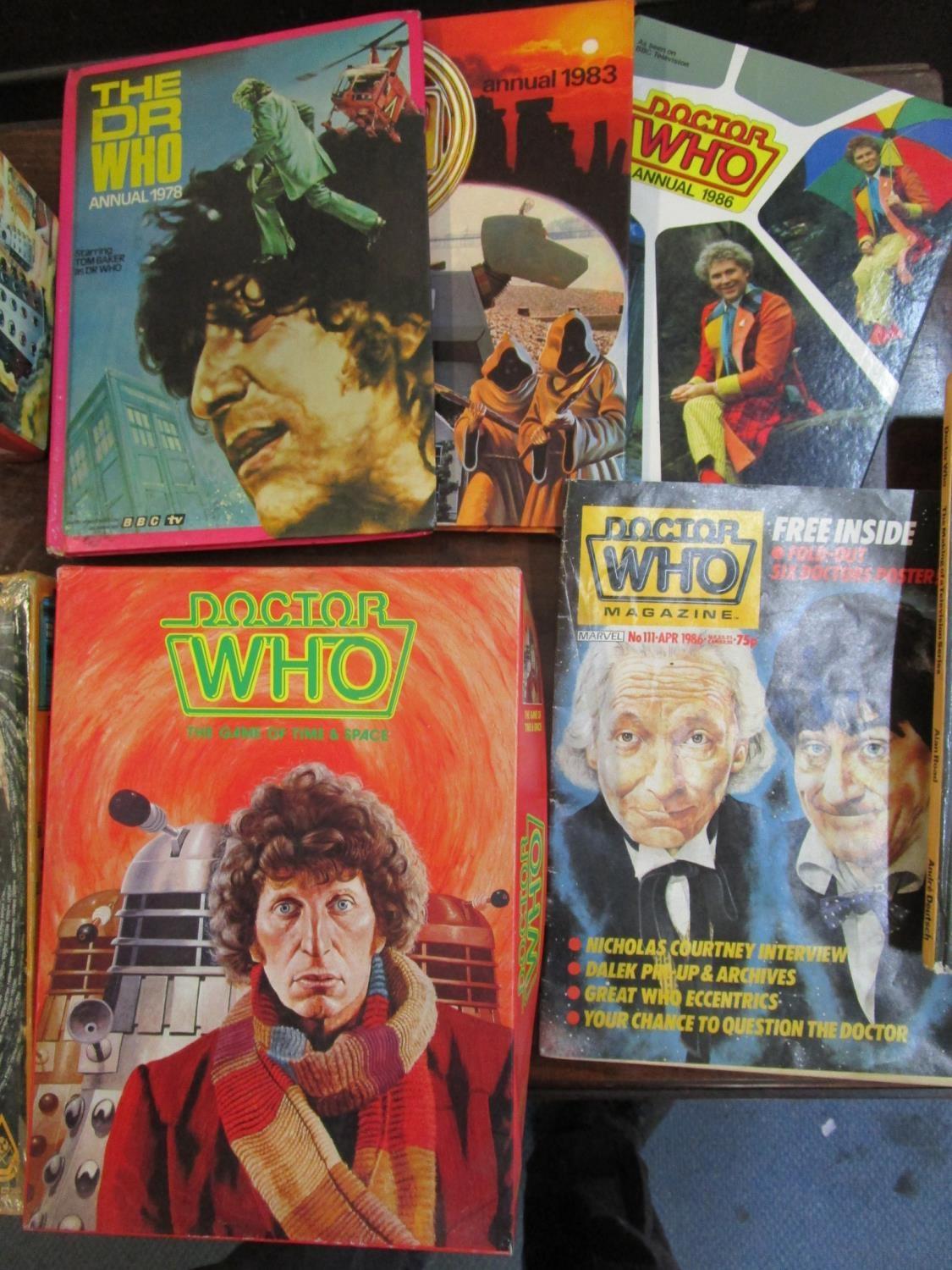 A collection of Dr Who books, some ex library, puzzles, annuals and badges to include an autographed - Image 4 of 6