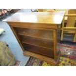 A modern hardwood three tier open bookcase 110cm h x 103cm w