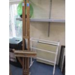A mixed lot comprising a green glass carboy, a mid 20th century pine artist's easel and a white