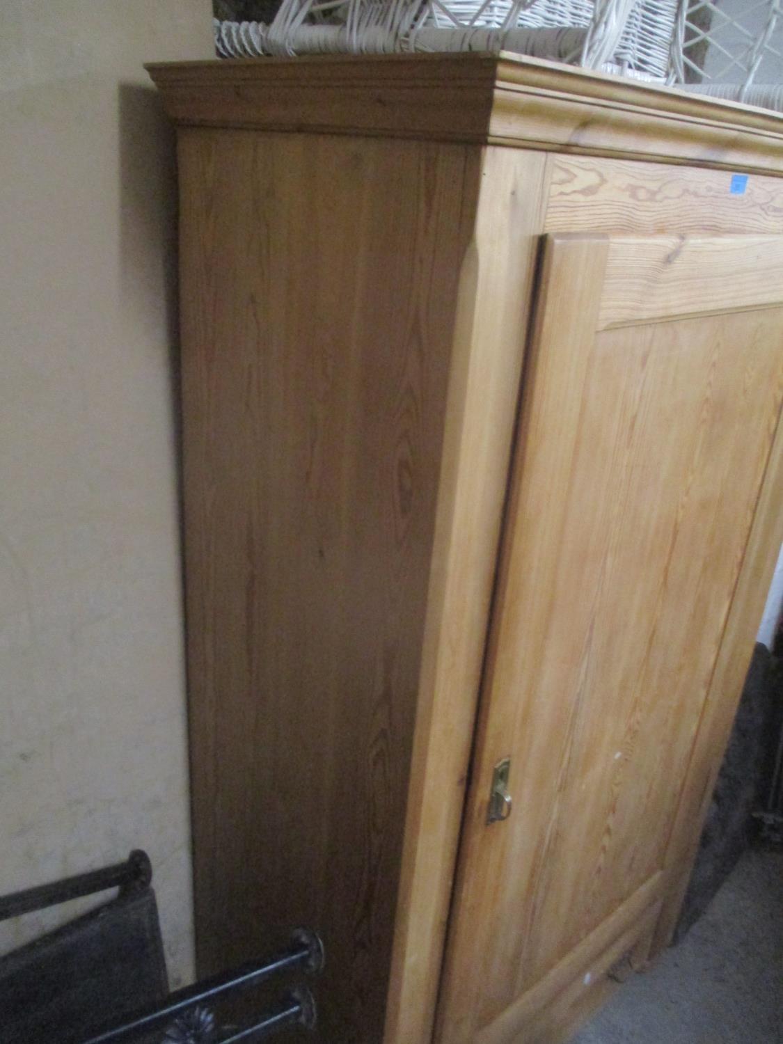 A reproduction pitch pine single door armoire with single drawer below, 175cm h x 102cm w - Image 2 of 2